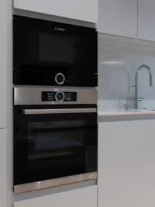 How Far Should Your Microwave Stick Out from Cabinets
